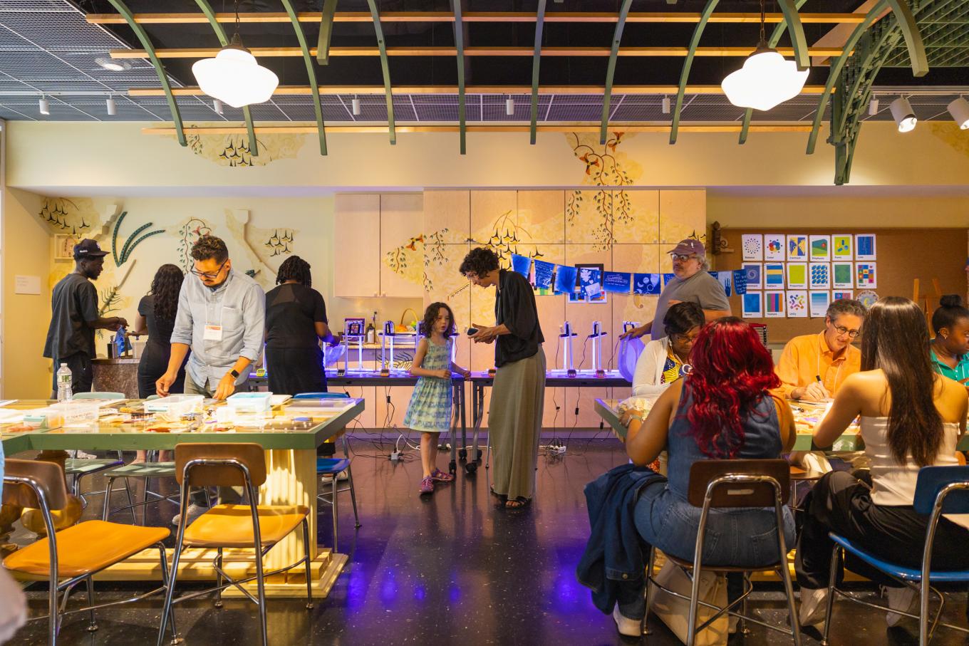 conference participants create cyanotype flags as part of the arts integration