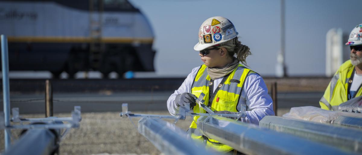 Union woman working on solar panels