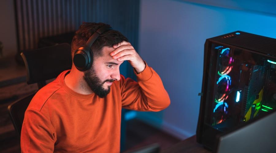 Software developer wearing a headset to filter out unwanted noise