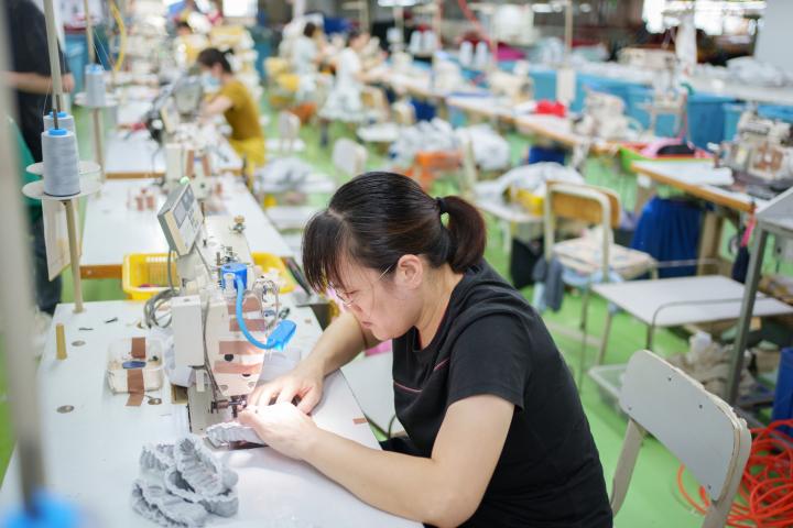 A woman in China working in a garment factory