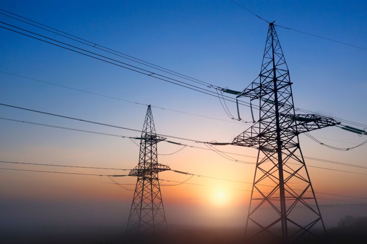 Transmission lines with the sun setting in the background