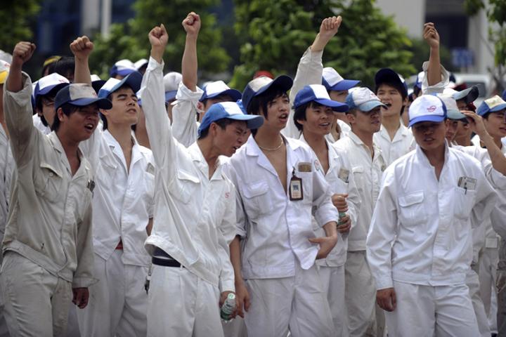 Chinese workers dressed in white at public demonstration